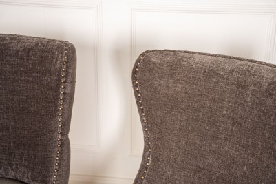 dark grey chair with studded seat